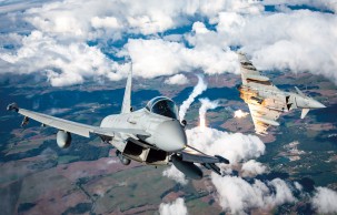 Two Italian Air Force Eurofighter Typhoons deployed for NATO Air Policing in Poland decoy flares on a training mission.
